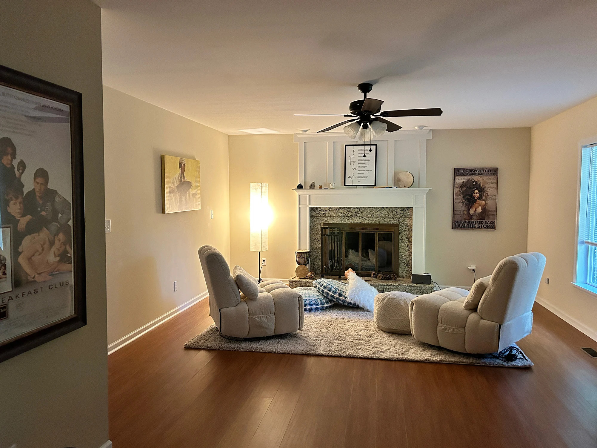 A warm, spacious living area with a fireplace and comfortable seating